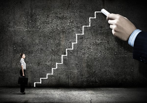 Businesswoman stepping ladder drawn by hand with chalk